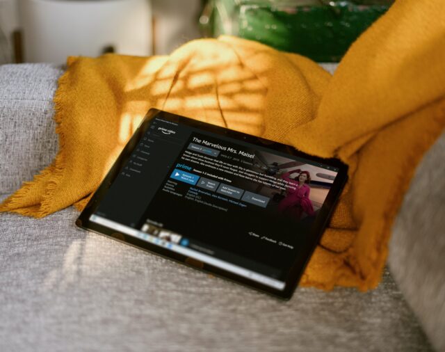 A tablet on a sofa shows people would rather watch ads than pay for video content.