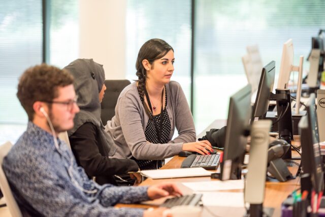 An image showing people working on their comupters