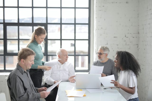 A team works in the office trying to promote diversity and inclusion in CX.