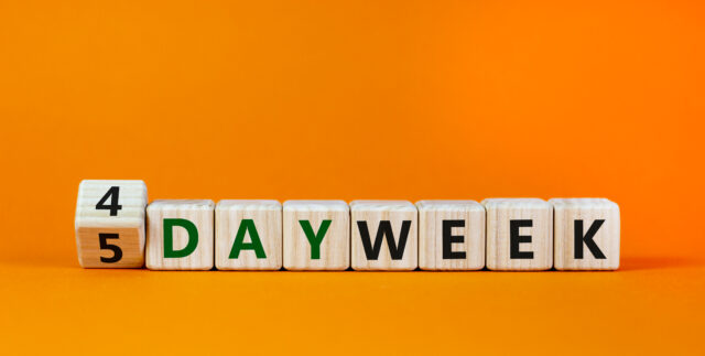 4-day work week written on wood blocks.