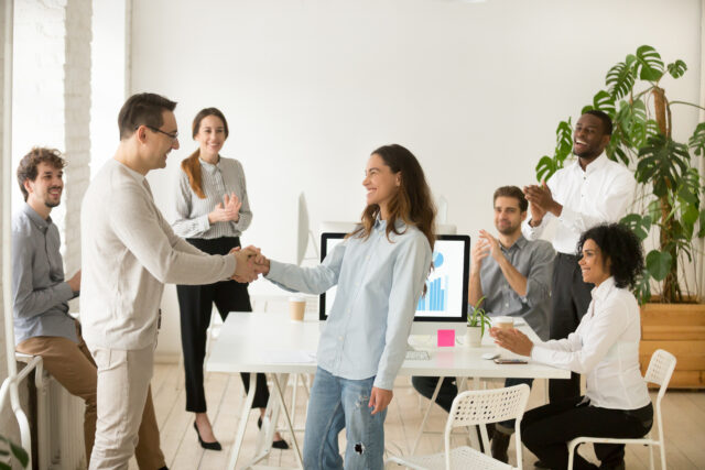 an image showing a young person having a happy first day of work
