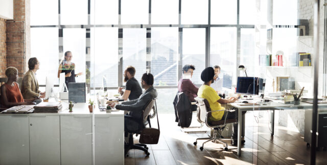 an image showing a group of employees building a hybrid work model.