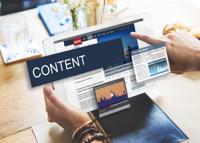 an image showing a person searching though the marketing content on internet