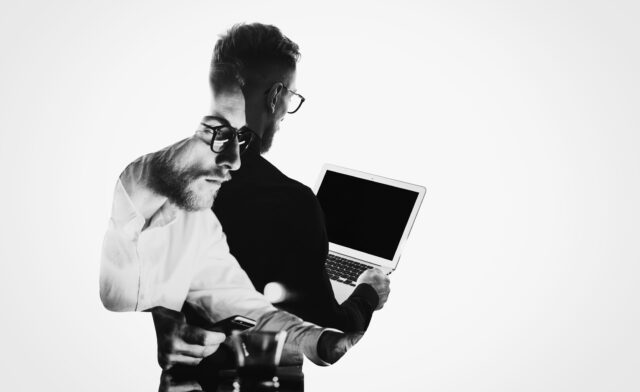 Consumer with laptop, third party vendor represented behind him
