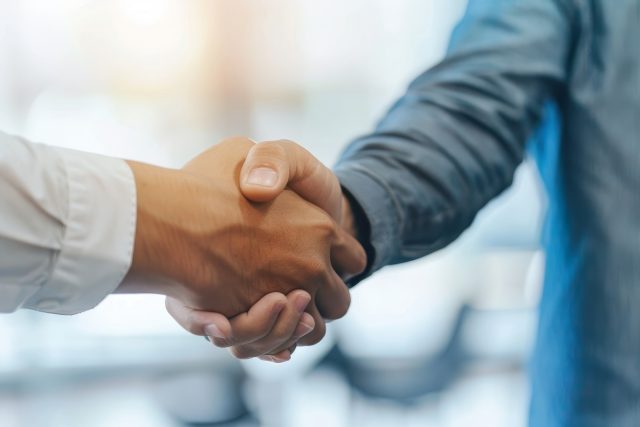 Businessmen handshake in photography shot business meeting and partnership concept