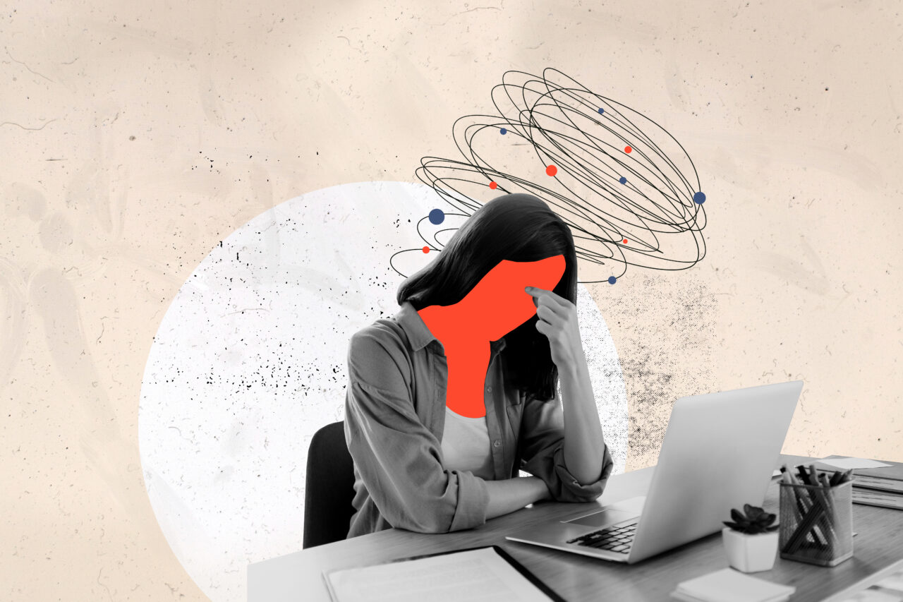 Stressed worker depicting impact of business performance on employee wellbeing