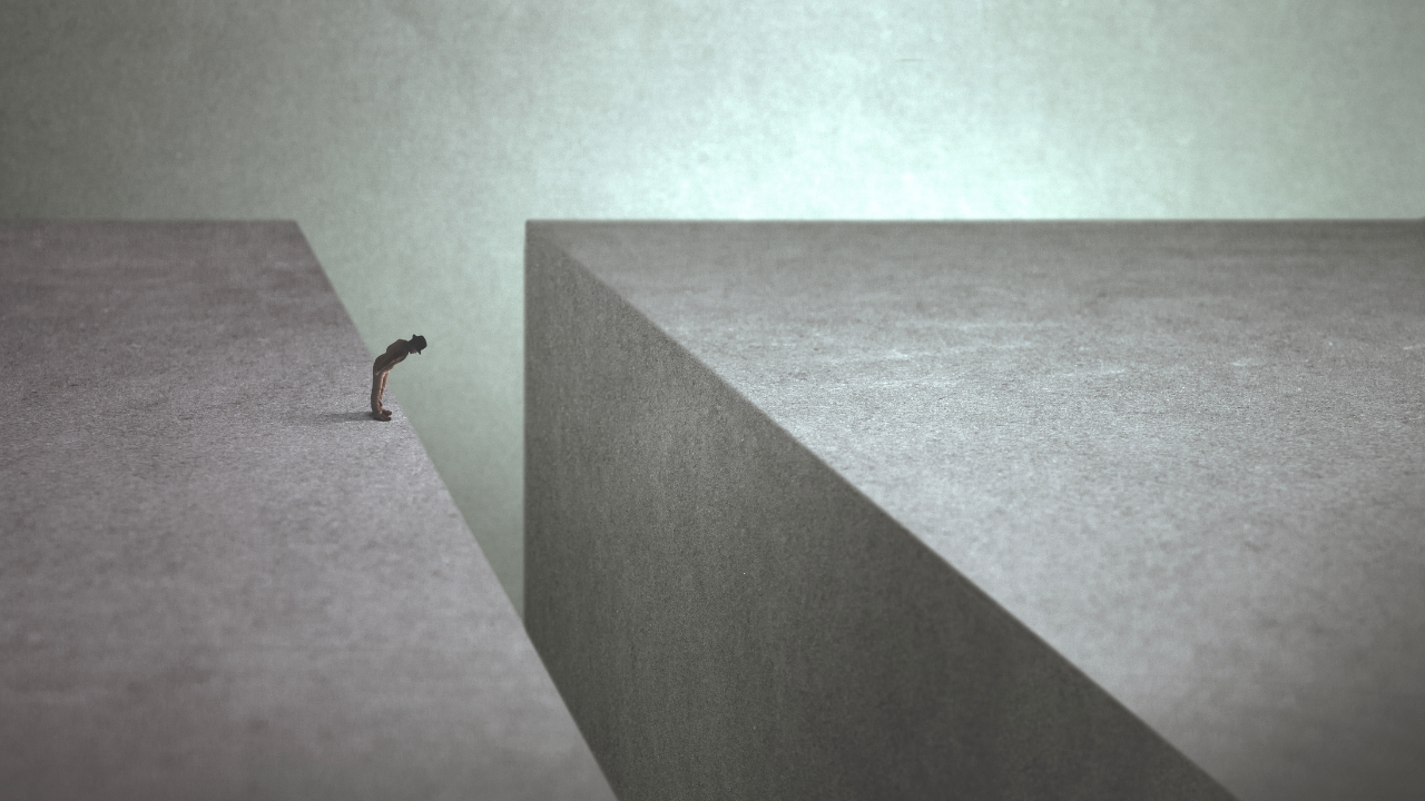 man on the edge afraid of jumping onto the other side, depicting perception gap in frontline experience
