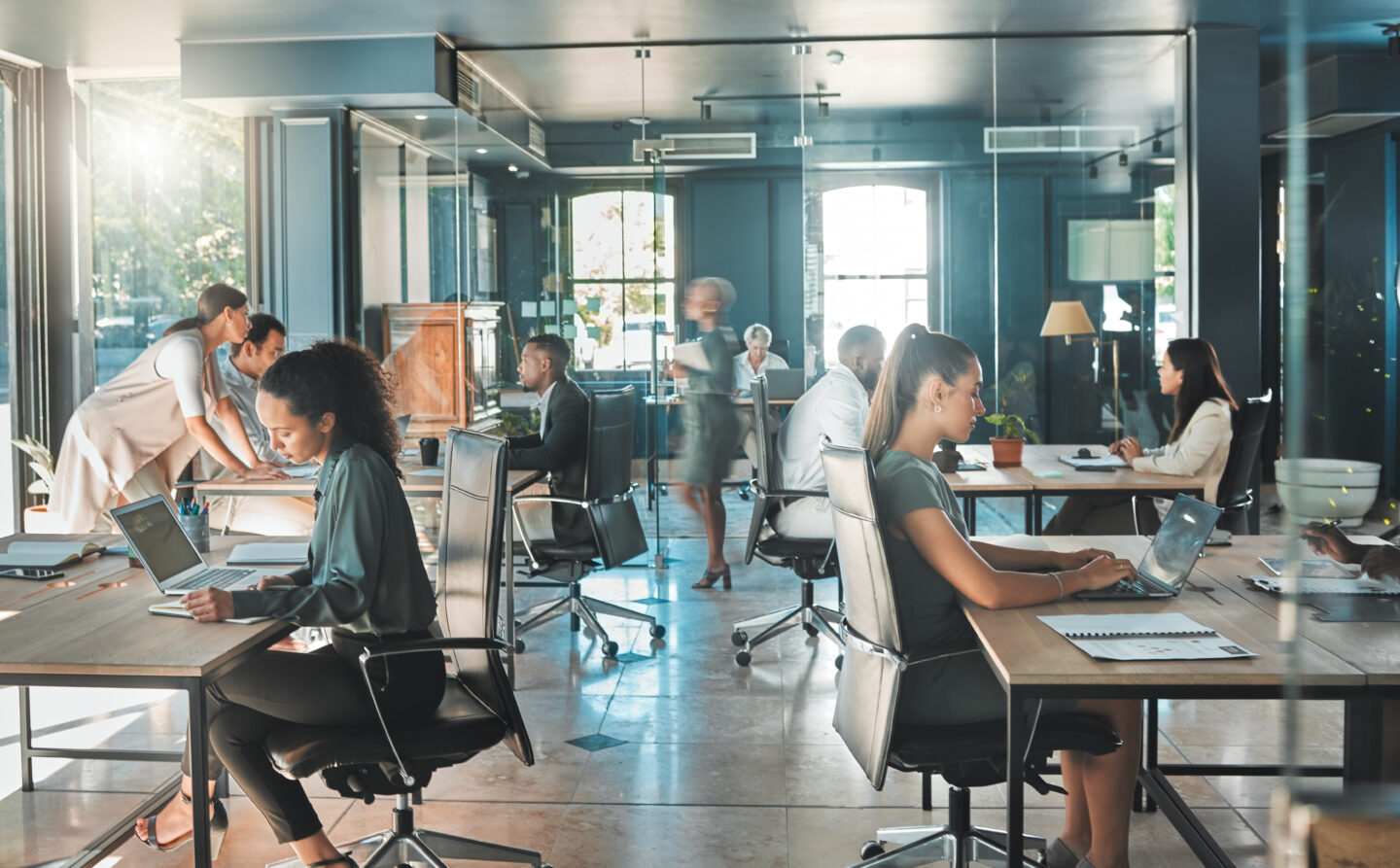 Corporate business people working in open plan office – employee experience