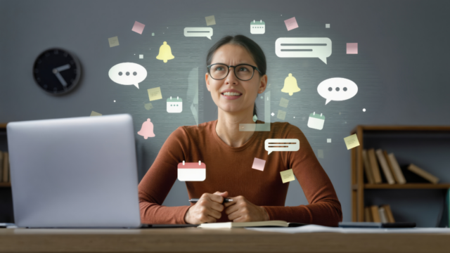 Woman managing digital overload with multiple notifications and multitasking at desk